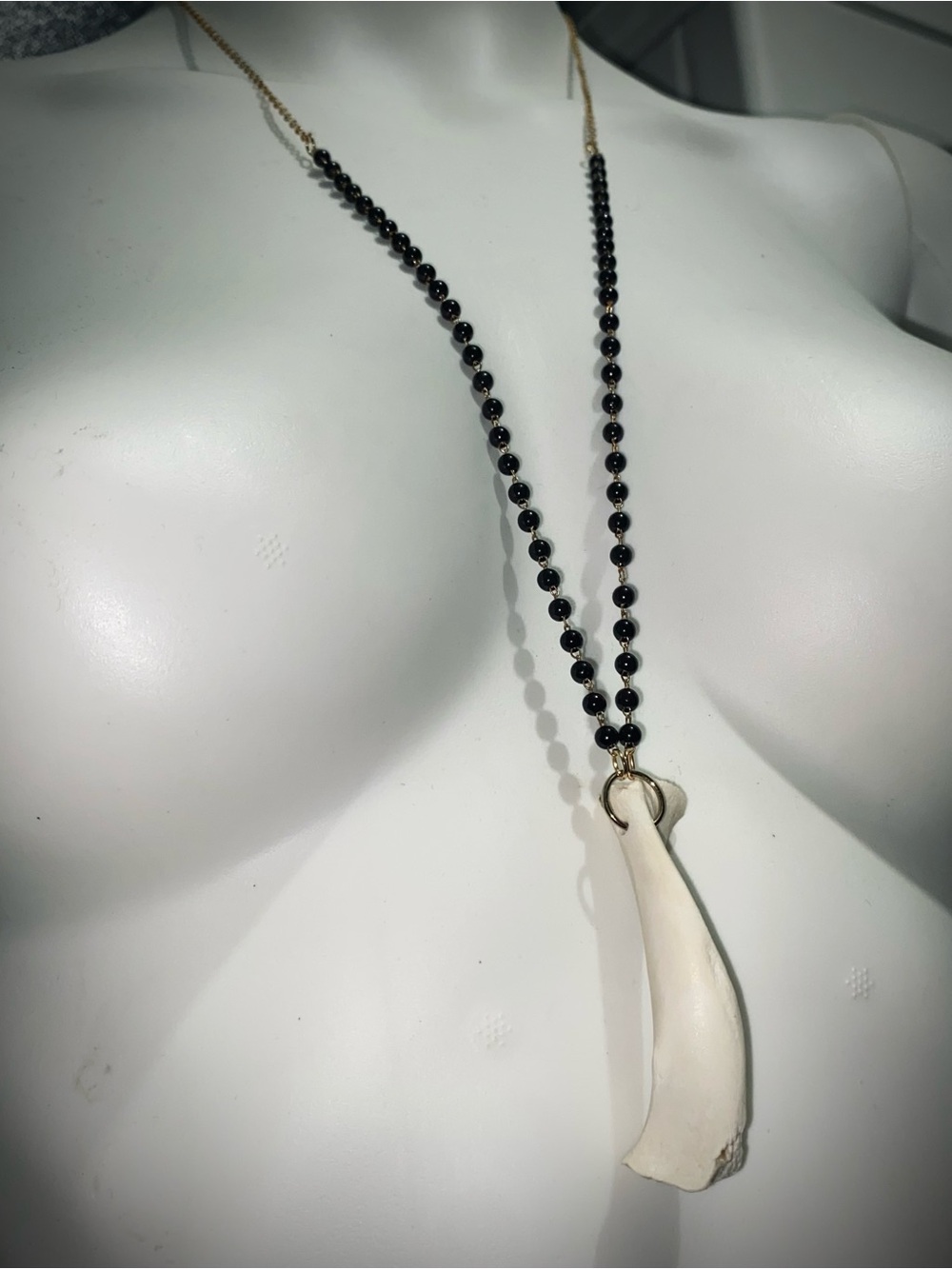 Armadillo bone black beaded gold chain necklace